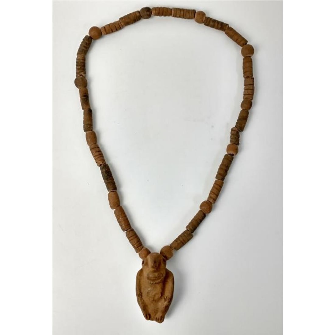 Pre-Colombian Bead Necklace w/ Large Pendant: Pre-Colombian Bead Necklace with Large Pendant. Condition: Generally Good. Dimensions: L- 33". Provenance: From a Long Island, NY Home. Please note the absence of a Condition Report does not imply tha