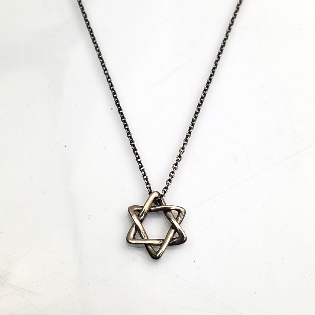 Judaica Tiffany & Co Sterling Silver "Magen David": Judaica Tiffany & Co. Sterling Silver "Magen David" Star of David Necklace. Designed by Elsa Peretti. Condition: Generally Very Good. Dimensions: Chain L- 16.25". Gross Weight: 1.7 g / 0.055 ozt. Prov