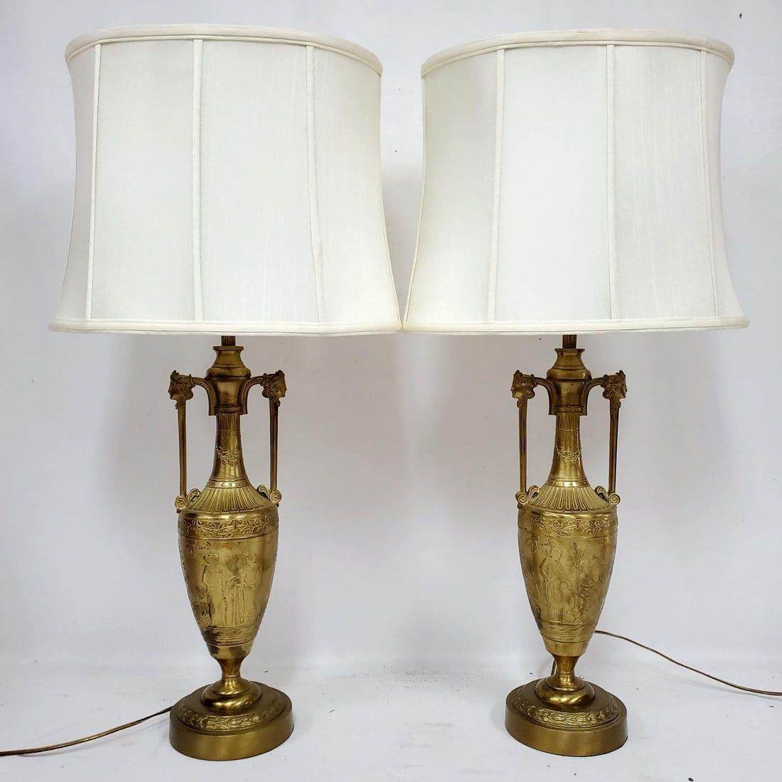 Unusual Pair of Bronze Lamps w/ Grecian Motif's: Unusual Pair of Bronze Lamps w/ Grecian Motif's. Condition: Generally Good Dimensions: Total H-32" Including Finial. Bronze Alone-H-18". Provenance: From a Long Island, NY Home. Please note the absenc