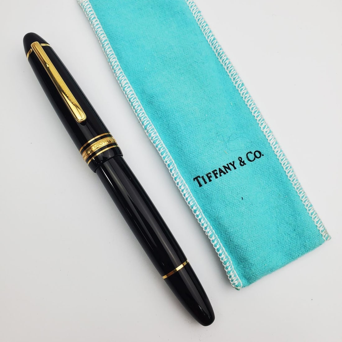 Tiffany & Co Montblanc Meisterstuck Fountain Pen: Tiffany & Co Montblanc Meisterstuck Fountain Pen #146 with Gold Nib. Condition: Generally Very Good. Dimensions: L-5.7".Provenance: From a Long Island, NY Home. Please note the absence of a Condition 