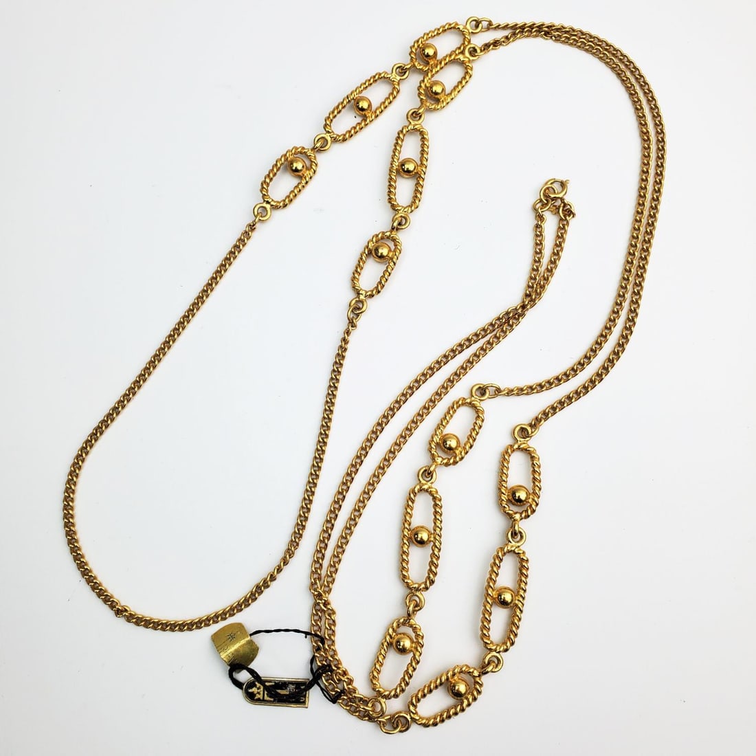 Trifari Long Chain Necklaces: Trifari Long Chain Necklaces. Fully Marked. Condition: Generally Very Good. Dimensions: L-52". Provenance: From a Long Island, NY Home. Please note the absence of a Condition Report does not imply tha