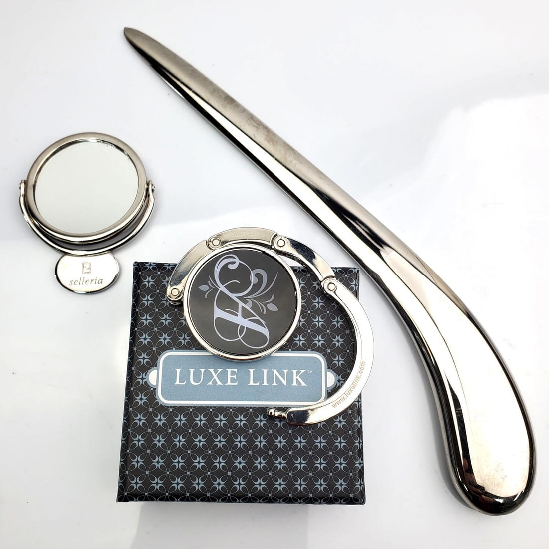 Interesting Lot of Luxury Items: Interesting Lot of Luxury Items Including a Fendi Stelleria Handbag Mirror Along w/ a Luxe Link Purse Holder (In Original Box & Unused) & an Unusual Letter Opener. Condition: Generally Very Good. Dime