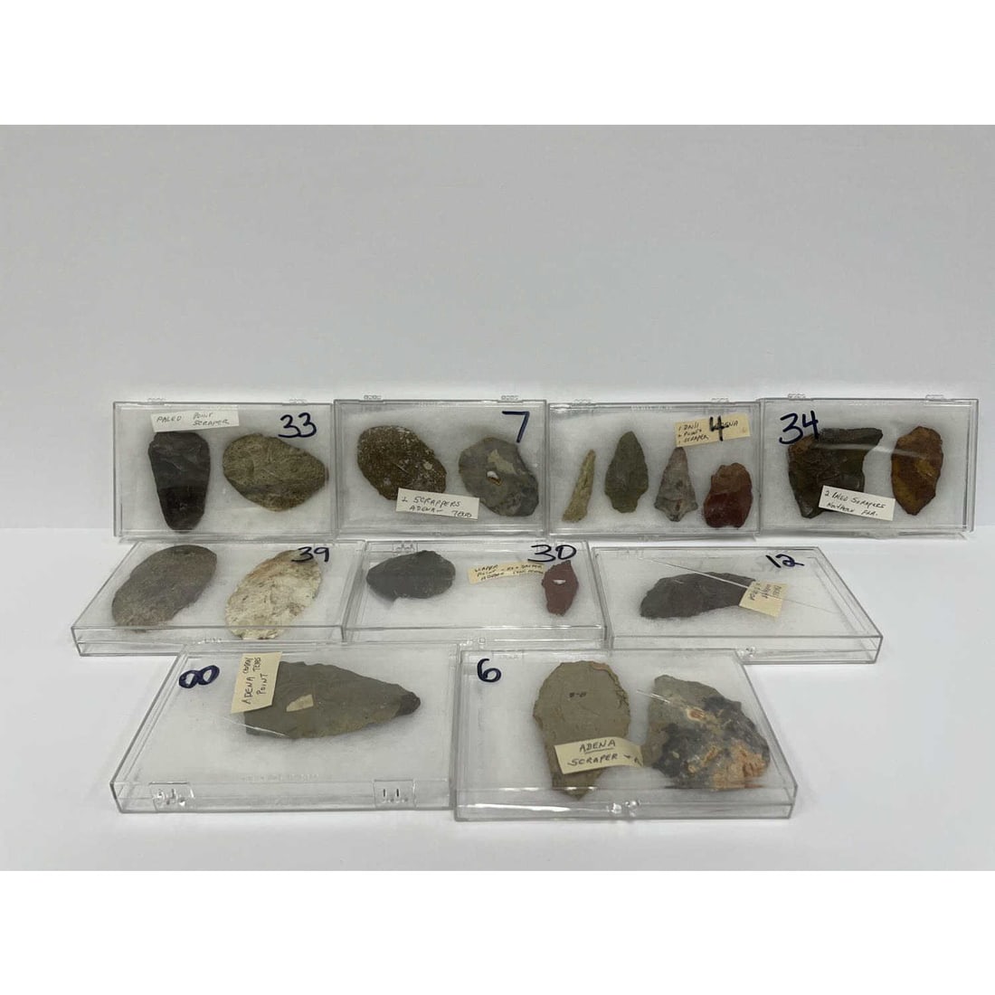 Large Lot of Native American Pieces: Large Lot of Native American Pieces Including Arrowheads, Adena, and Scrapers. All in their Own Cases. Condition: Generally Good, SOLD AS IS. Dimensions: Various Sizes. Provenance: From a Long Island,