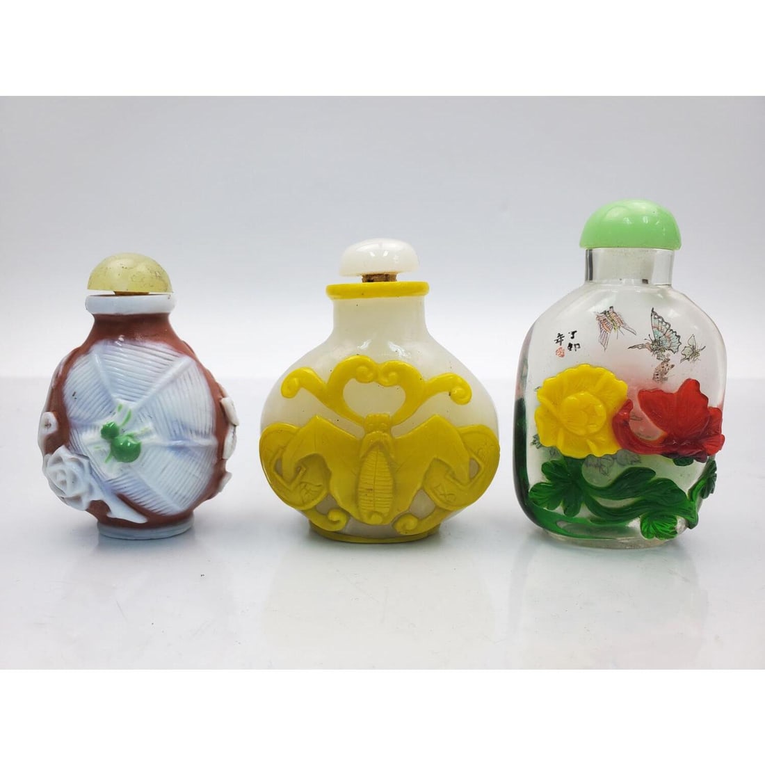 3 Vintage Chinese Peking Glass Snuff Bottles: Lot of 3 Vintage Chinese Peking Glass Snuff Bottles. All Are Beautifully Overlaid & Carved. Condition: Generally Good. Dimensions: Largest--3". Provenance: From a Long Island, NY Home. Please note the