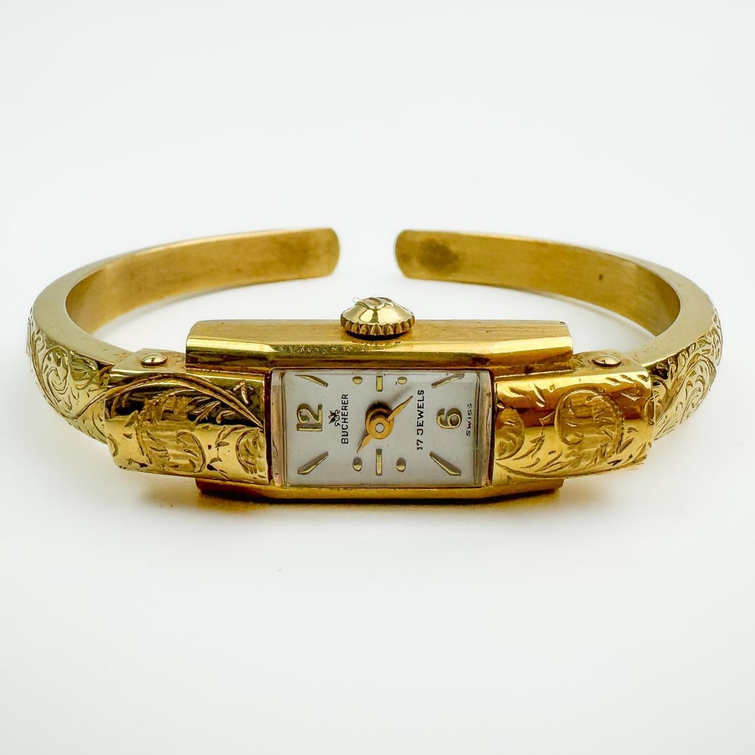 Vintage 18K Gold Bucherer Ladies Bangle Watch: Vintage 18K Gold Bucherer 17 Jewels Swiss Bangle Watch. Fully Hallmarked in Various Places. Condition: Generally Very Good. Please Note-We Do Not Guarantee The Workability of Any Used Watches.Dimensio
