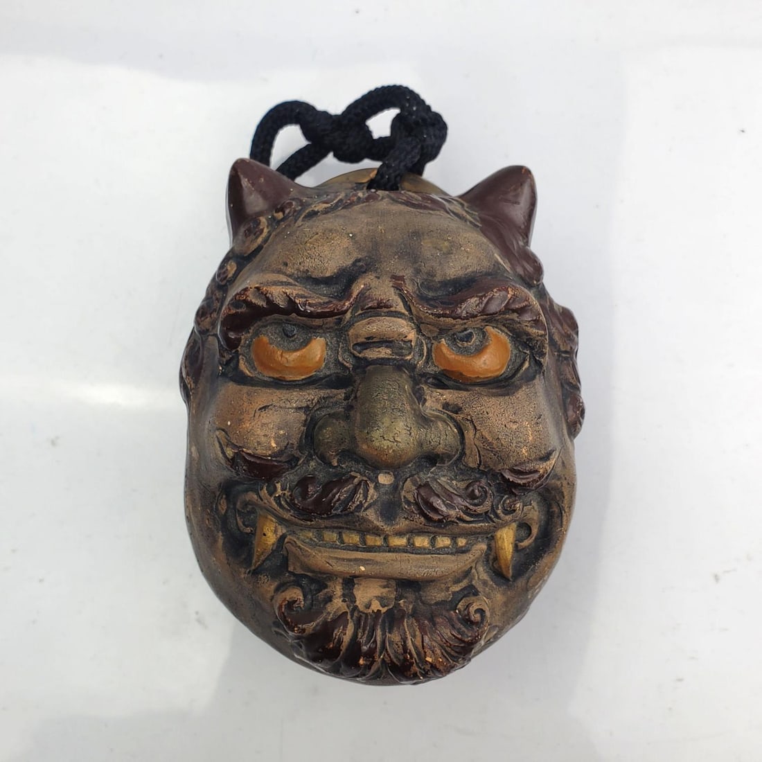 Unusual Signed Japanese Meiji Period Bell: Unusual Signed Japanese Meiji Period Terracotta Bell with Two Faces. Condition: Repaired & Restored. Sold As Is. Dimensions: H-4.25" x W-3.25" x D-3.25". Provenance: From a Long Island, NY Home. Pleas