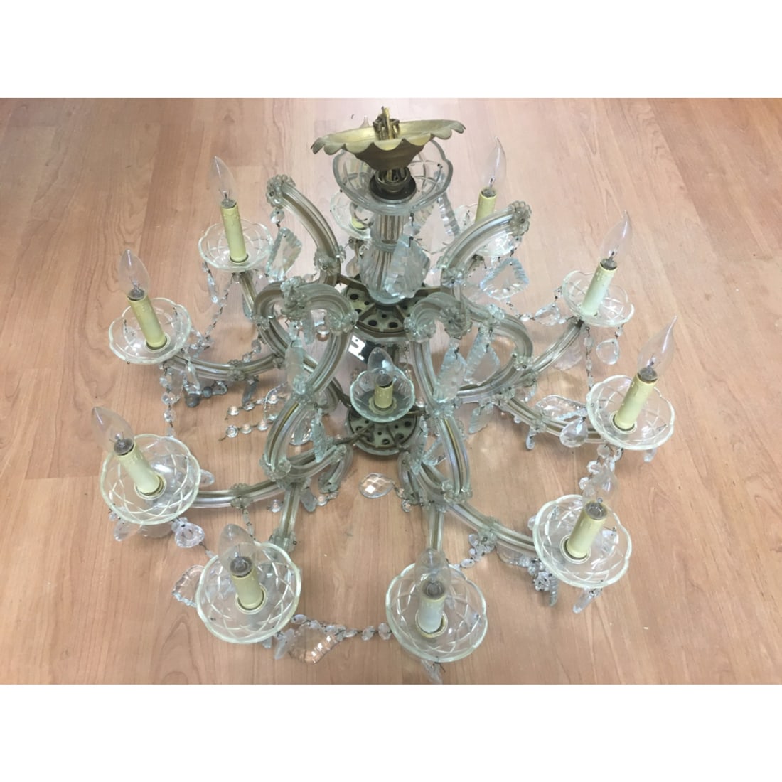 Old Large Cut Glass Chandelier: Old Large Cut Glass Chandelier. Condition: Generally Good. Missing Some Pieces. SOLD AS IS. Needs Cleaning. Dimensions: H-20" x W-26". Provenance: From a Long Island, NY Home. Please note the absence 