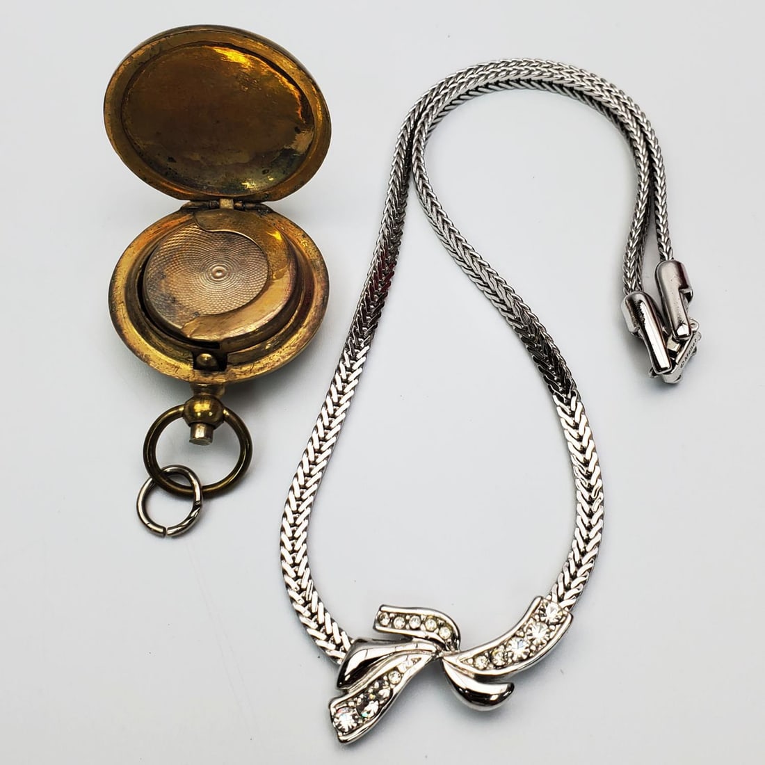 Vintage Monet Costume Jewelry Necklace: Vintage Monet Costume Jewelry Necklace Along w/ an Old Coin Holder Pendant. Condition: Generally Good. Dimensions: Various Sizes. Provenance: From a Long Island, NY Home. Please note the absence of a 