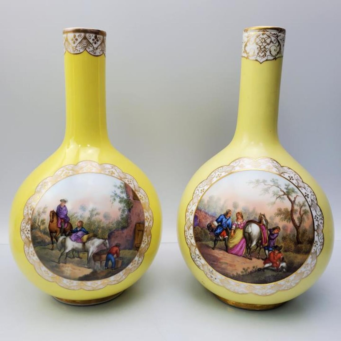Pair of Antique Meissen Yellow Ground Vases: Pair of Antique Meissen Yellow Ground Vases Each with Watteau Paintings on Both Sides. Fully Marked. Condition: One is Excellent, the Other Appears to have an Old Repair on the Top of the Vase. Dimens