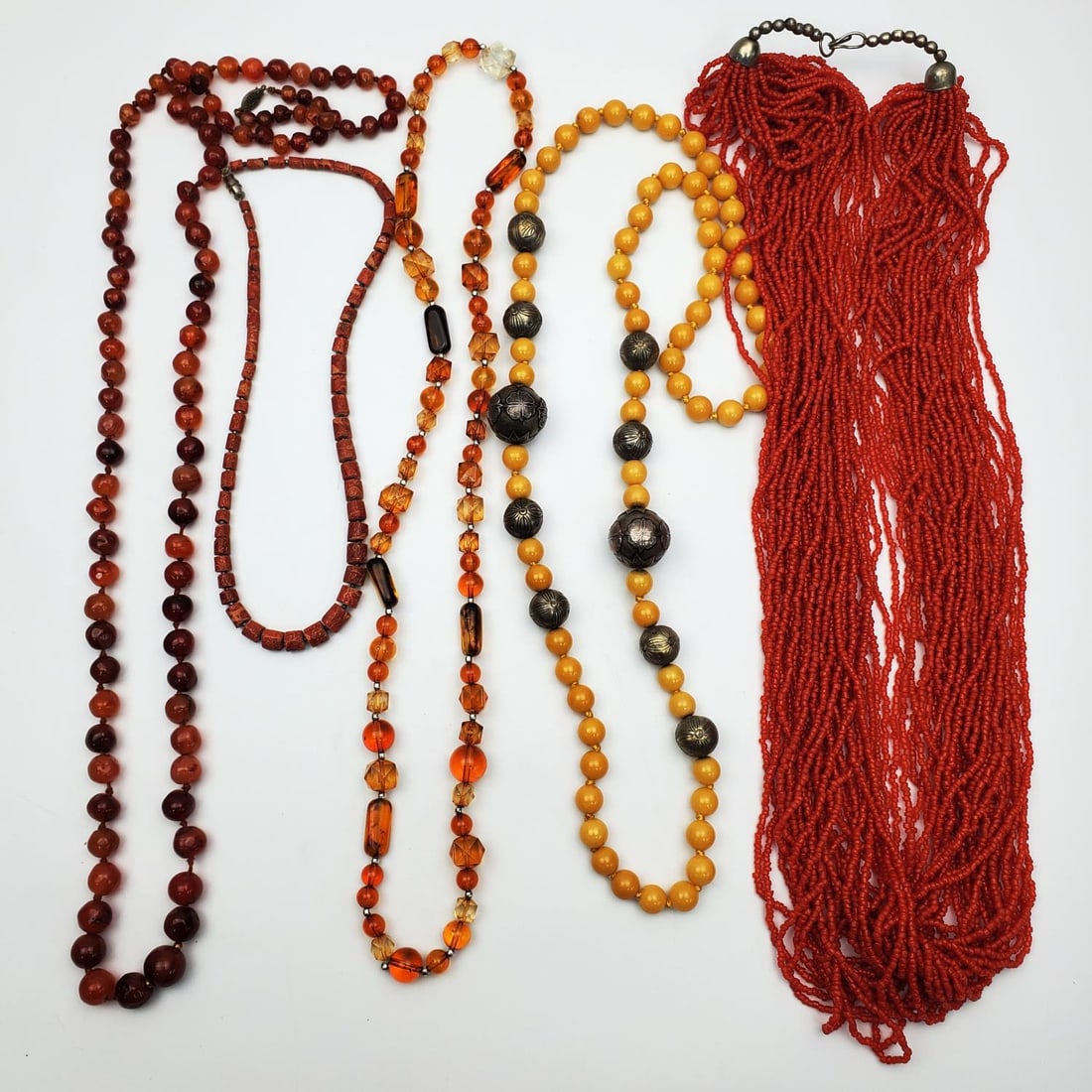 Lot of 5 Jewelry Necklaces: Lot of 5 Jewelry Necklaces. One Might Be Agate, Two Might Be Coral, Etc. Condition: Generally Good. Dimensions: Various Sizes. Longest L-41". Provenance: From a Long Island, NY Home. Please note the a