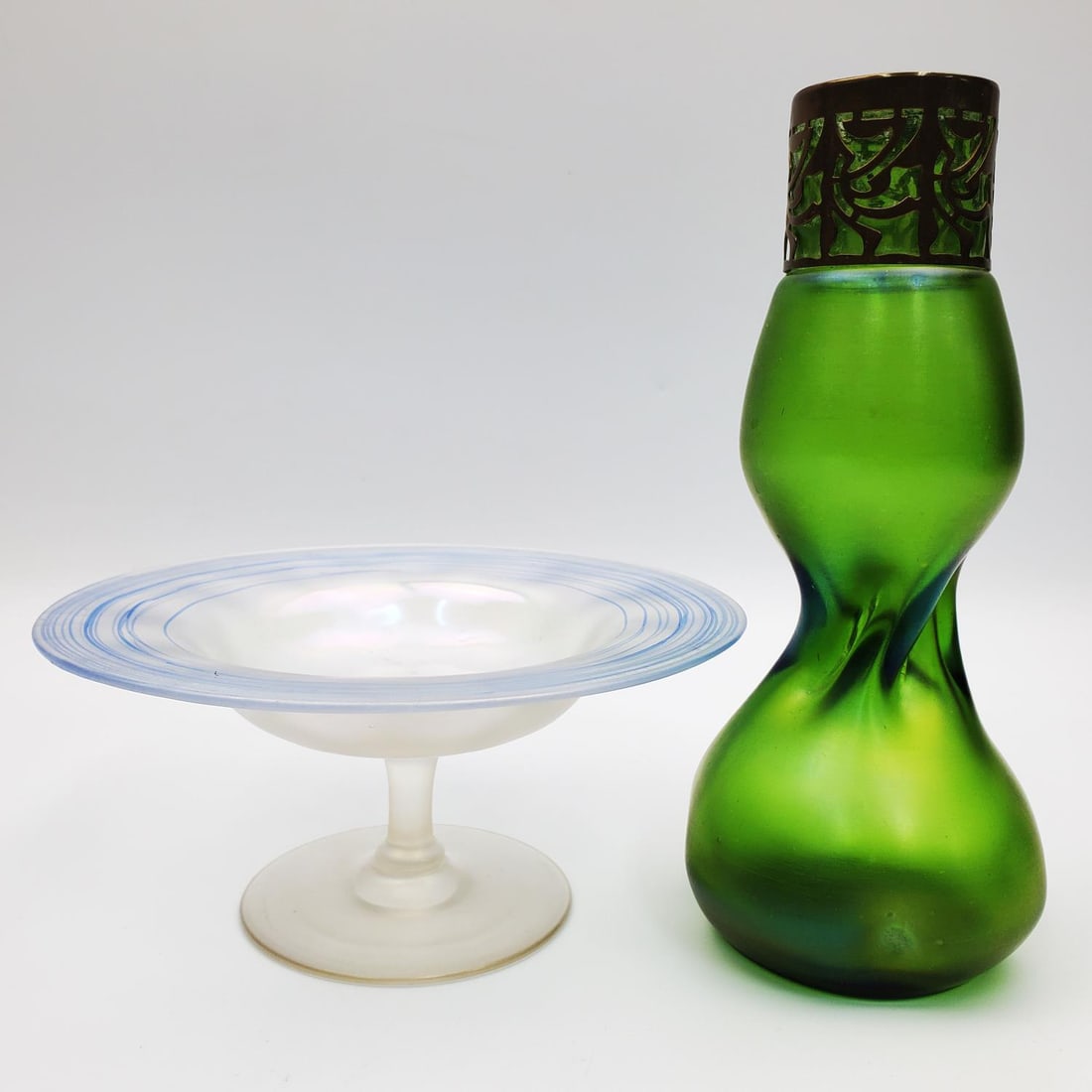 Lot of 2 Vintage Art Glass Iridescent Items: Lot of 2 Vintage Art Glass Items Including a Loetz Style Vase & a Footed Bowl.Condition: Excellent.Dimensions: Vase-H-7". Bowl-Dia-6". Provenance: From a New York City Home. Please note the absence of