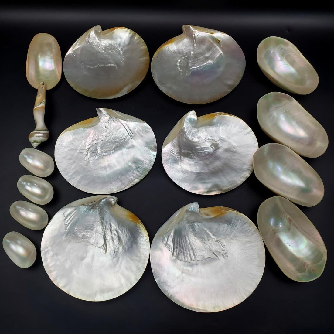 Large Lot of Mother of Pearl Plates, Bowls & Spoon: Large Lot of Mother of Pearl Plates, Bowls & Serving Spoon. Very Unusual Set. 15 Pieces Total. Condition: Generally Very Good. Dimensions: Largest Plate-7.2" x 6.7". Serving Spoon-L-8.5" Provenance: F