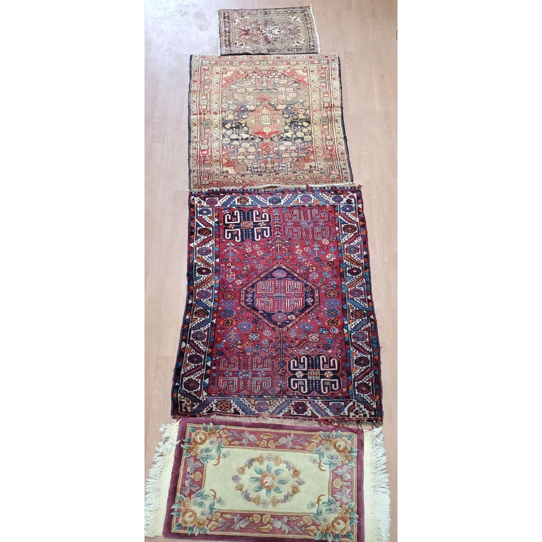 Lot of 3 Persian Rugs Along w/ another: Lot of 3 Persian Rugs Along w/ another. Condition: As Found. Dimensions: Largest- 5ft x 3.5ft. Provenance: From a Long Island, NY Home. Please note the absence of a Condition Report does not imply tha