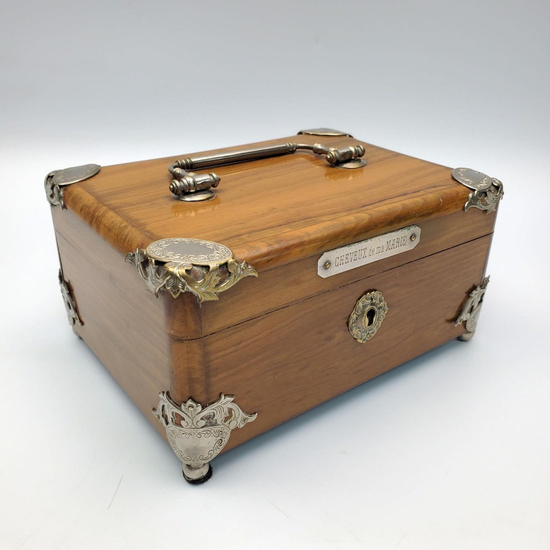 Antique French Wooden Box w/ Bronze Detailing: Antique French Wooden Box w/ Bronze Detailing & Handle. Plaque is Engraved w/ "Cheveux de ma Marie". Comes w/ Key. Condition: Generally Very Good. Dimensions: L-6" x W-4.5" x H-3.25". Provenance: From