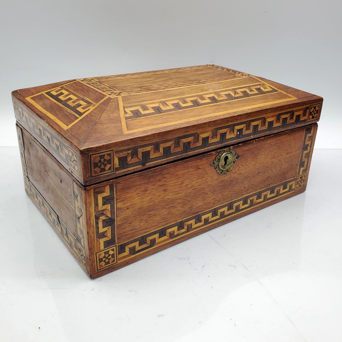 Marquetry Wood Inlaid Jewelry Casket Box: Marquetry Wood Inlaid Jewelry Casket Box. Does Not Come w/ Key. Condition: Generally Good. Dimensions: L-11" x W-7" x H-4.5". Provenance: From the Estate of an Important Private Long Island, NY Collec