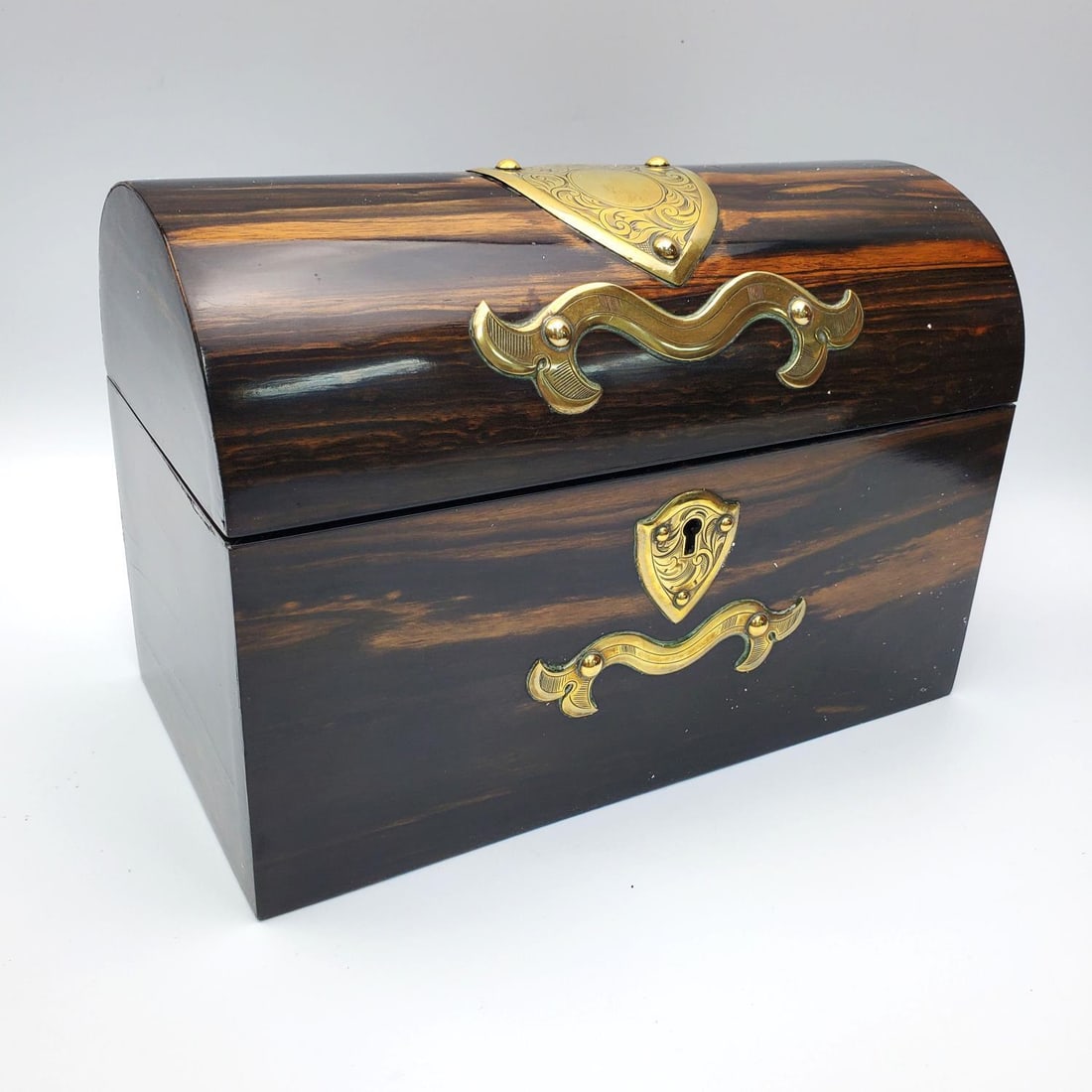 Antique English Coromandel Wood Stationary Box: Antique English Coromandel Wood Stationary/Letter Box w/ Brass Mounts. Comes w/ Original Key. Condition: Generally Very Good. Dimensions: L-9.25" W-5" x H-6.5". Provenance:From the Estate of an Import