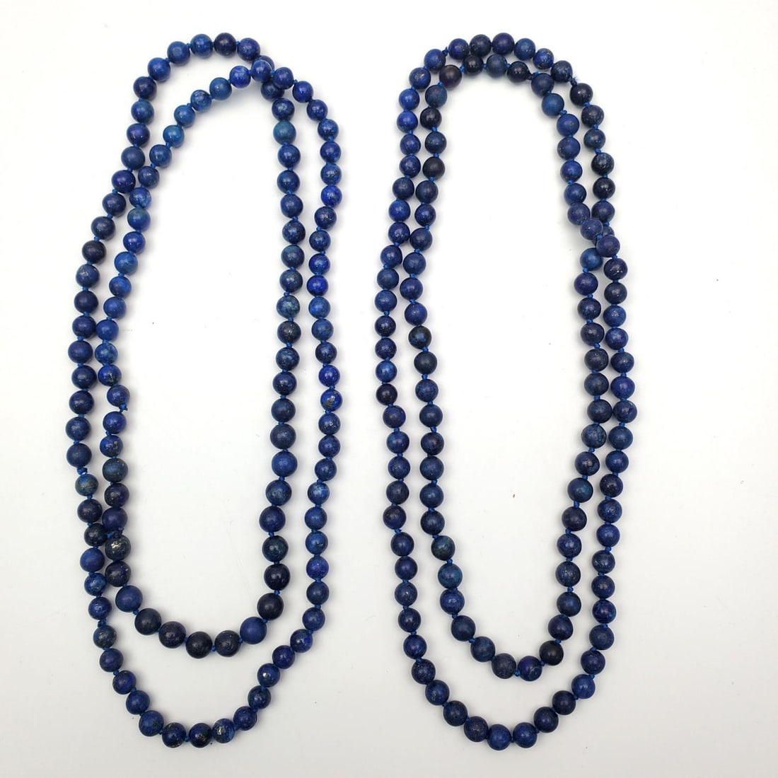 Pair of 2 Long Lapis Lazuli Beaded Necklaces: Pair of 2 Long Lapis Lazuli Beaded Necklaces. Condition: Generally Very Good. Dimensions: L-34" Each. Gross Weight: 114.7g. Provenance: From a Long Island, NY Home. Please note the absence of a Condit