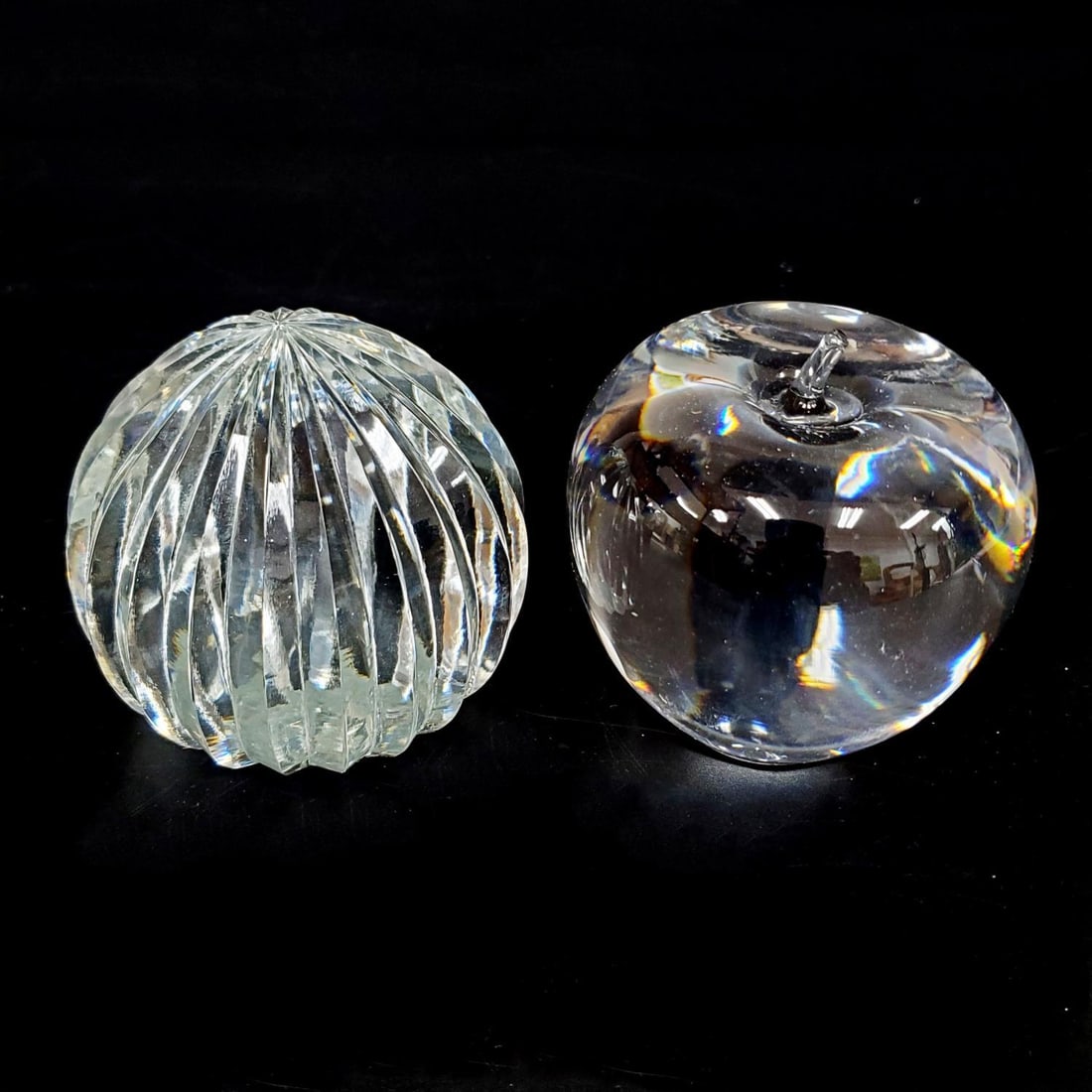 Lot of 2 Tiffany & Co Glass Paper Weights: Lot of 2 Tiffany & Co Glass Paper Weights Including 1 Depicting an Apple & Another. Fully Marked on the Bottom. Condition: Generally Very Good. Dimensions: H-3.75" x Dia-3.75". Provenance: From a Long