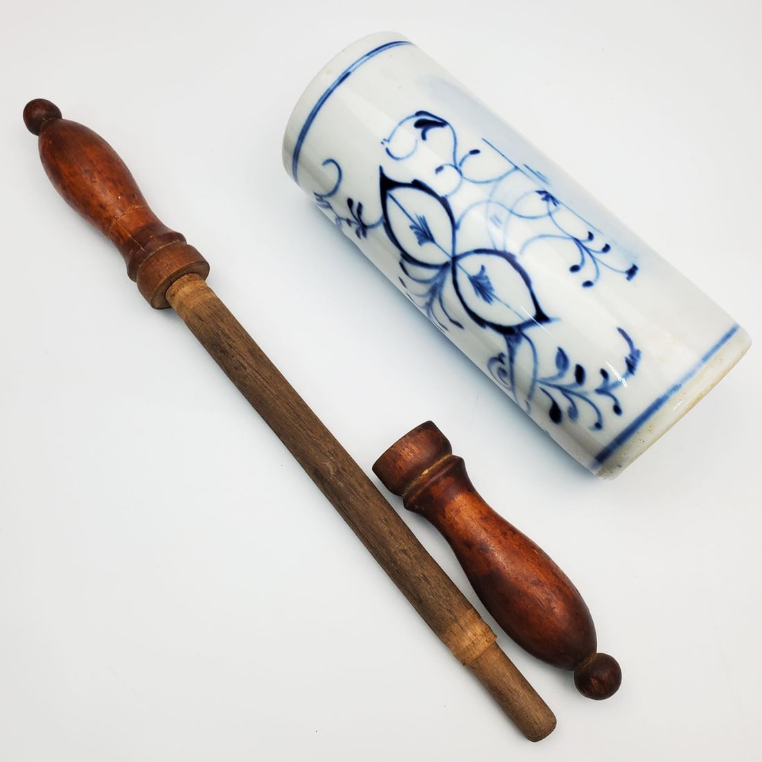 Antique Blue & White Signed Porcelain Rolling Pin: Antique Blue & White Signed Porcelain Rolling Pin w/ Wood Handles. Fully Marked. Condition: Generally Very Good. Dimensions: Size of Porcelain Alone L-6.75 x Dia-2.75". Total Length w/ Wood Handles-15