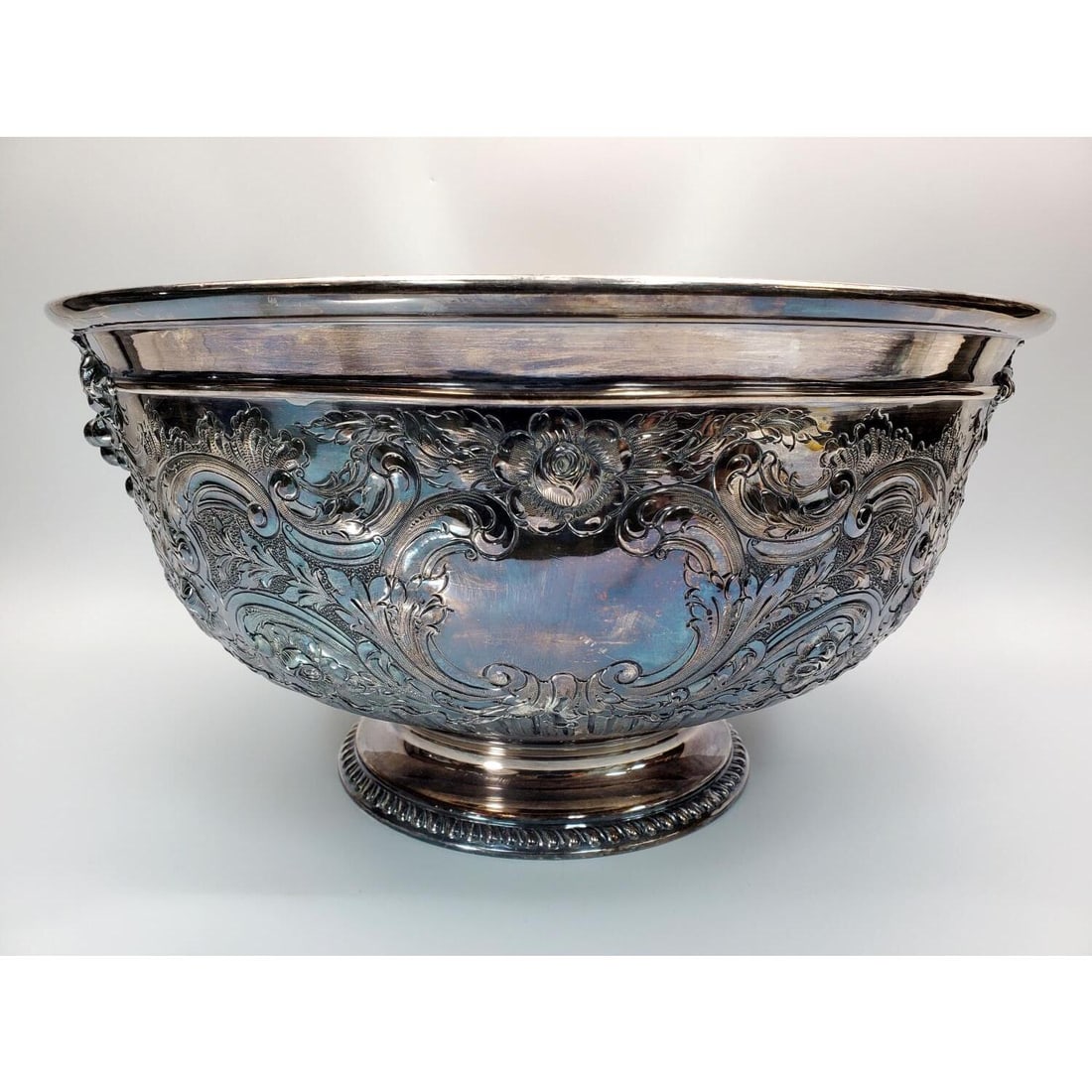 Large Antique Reed & Barton Hand Chased Punch Bowl: Large Antique Reed & Barton Hand Chased Punch Bowl. Condition: Generally Very Good. Dimensions: Dia-16.25" x H-8.25". Provenance: From a Long Island, NY Home. Please note the absence of a Condition Re