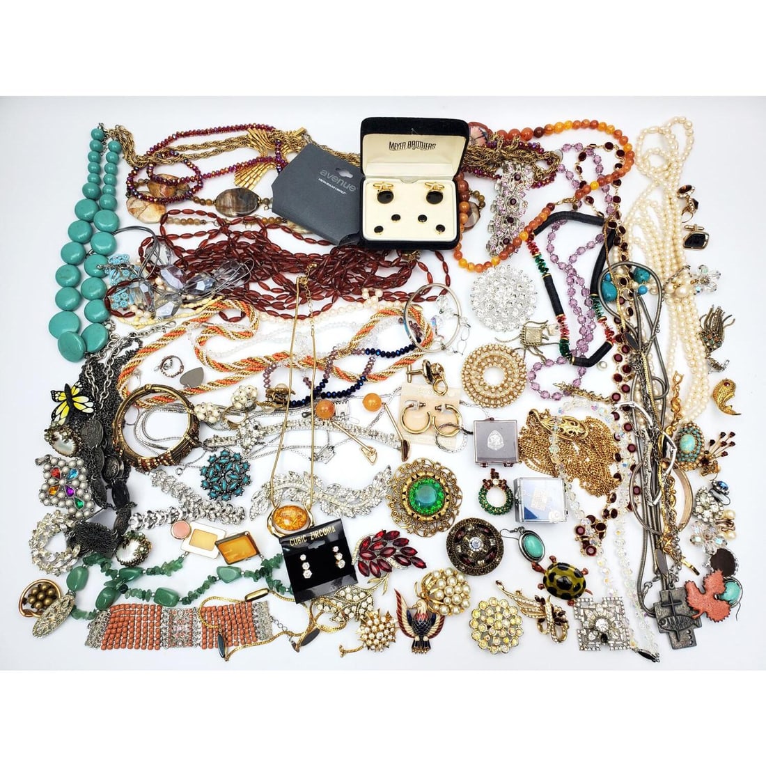 Large Bag Lot of Good Quality Costume Jewelry: Large Bag Lot of Good Quality Costume Jewelry Including Swarovski, Monet, Trifari & Filled Items. May Contain Silver As Well. Condition: As Found.Dimensions: Various Sizes. Provenance: From a Long Isl
