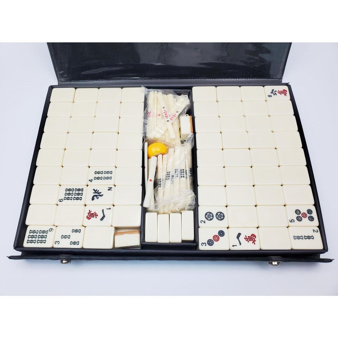 Mahjong Set: Mahjong Set. Condition: Generally Good. Sold As Is. Dimensions: Case-12.75" x 9" x 1.5". Provenance: From a Long Island, NY Home. Please note the absence of a Condition Report does not imply that ther