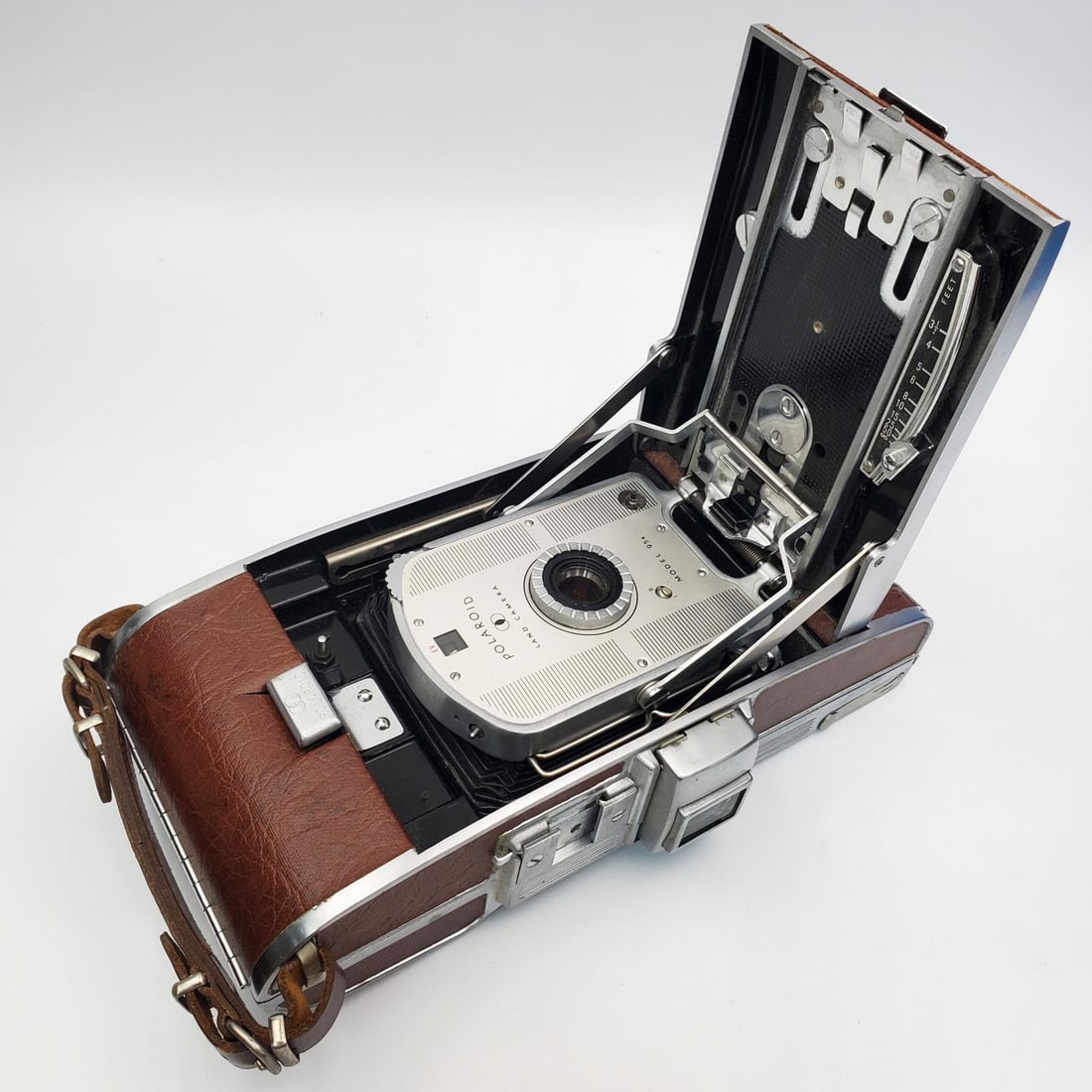 Old Polaroid Land Camera: Old Polaroid Land Camera. Condition: Sold As Is. We Cannot Guarantee the Workability of Any Old Cameras. Dimensions: L-9.5" x W-4.5". Provenance: From a Long Island, NY Home. Please note the absence o