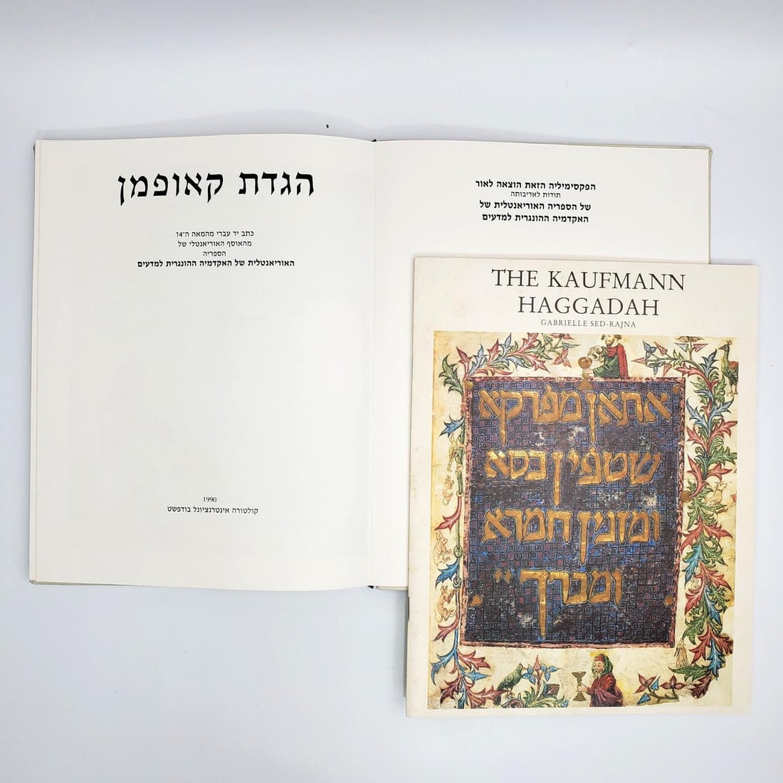 Judaica "The Kaufmann Haggadah, Facsimile Edition" Hard Cover Book: Judaica "The Kaufmann Haggadah, Facsimile Edition" Hard Cover Book. Hungarian Academy of Sciences. Numbered Edition. Printed in Hungary. In Original Box. Condition: Generally Good. Box is a Bit Worn. 