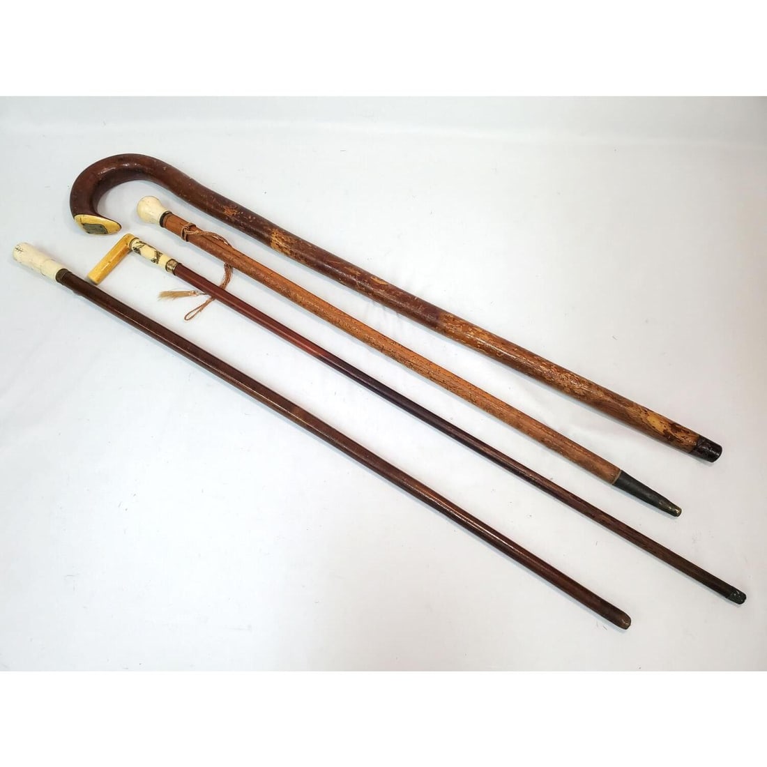 Lot of 4 Antique Wooden Canes: Lot of 4 Antique Wooden Canes Including One 19th Century Circa 1872 Walking Stick Cane w/ Bone Handle, Presented to B. Van Gausbeek. Condition: Sold As Is. Dimensions: Longest L-36". Provenance: From