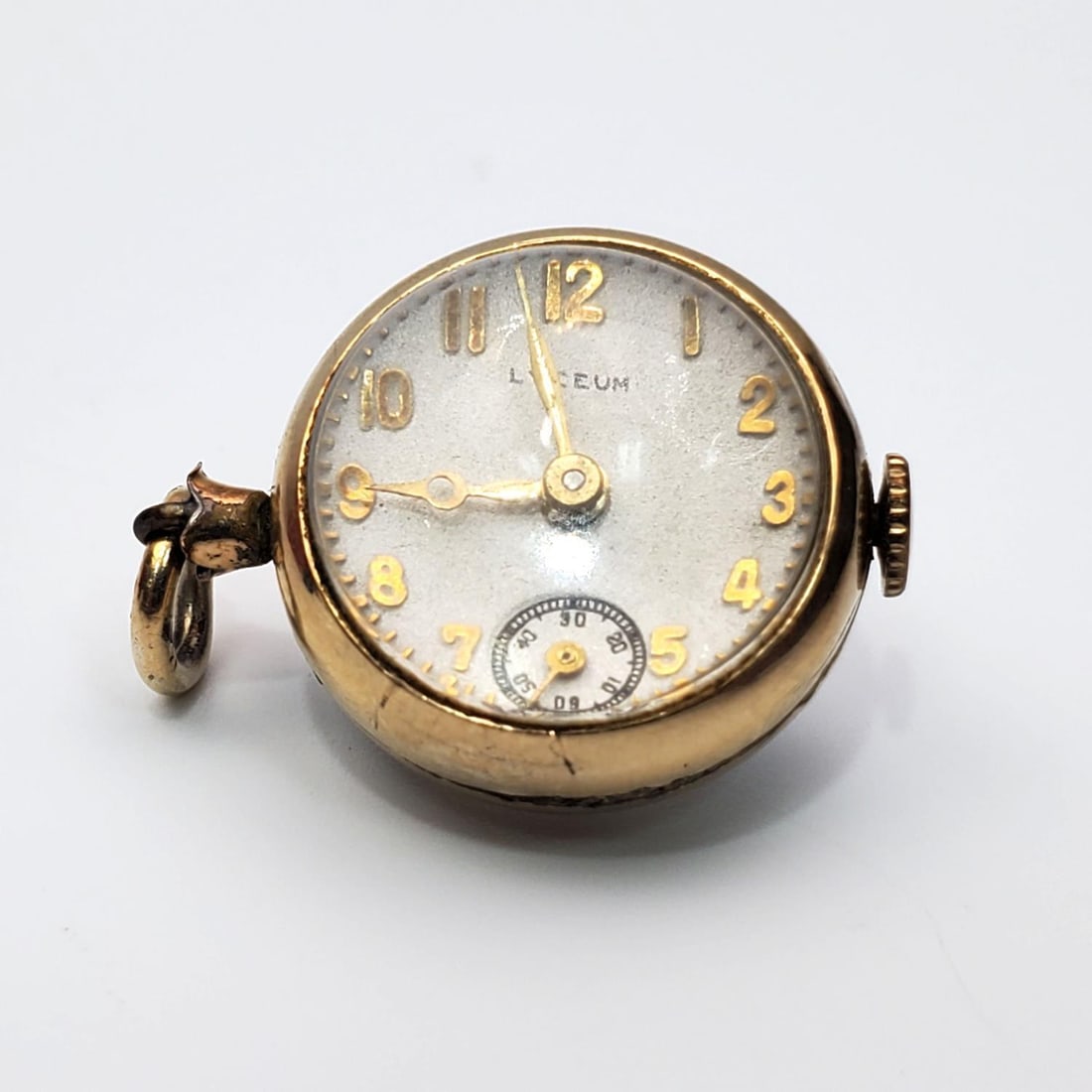 Antique Lyceum Crystal Ball Watch Pendant: Antique Lyceum Mechanical Crystal Ball Watch PendantCondition: Generally Good. Please Note- We Do Not Guarantee the Workability or Mechanism of Any Watches or Clocks. Dimensions: Dia-0.75". Provenance