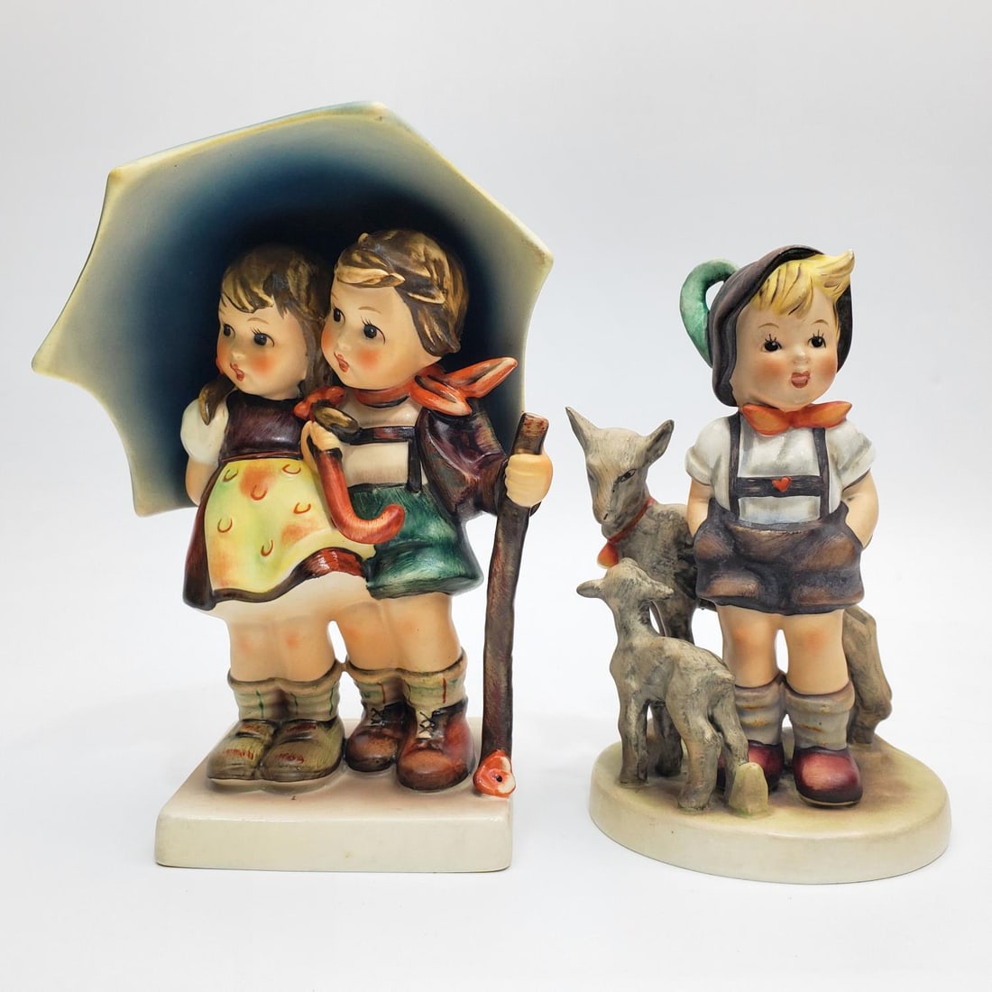 Lot of 2 Vintage Goebel German Porcelain Figures: Lot of 2 Vintage Goebel German Porcelain Figures Including "Stormy Weather" & "Little Goat Herder". Both are Fully Marked. Condition: Generally Very Good. Dimensions: Larger H-6.25" x W-4.5". Provenan