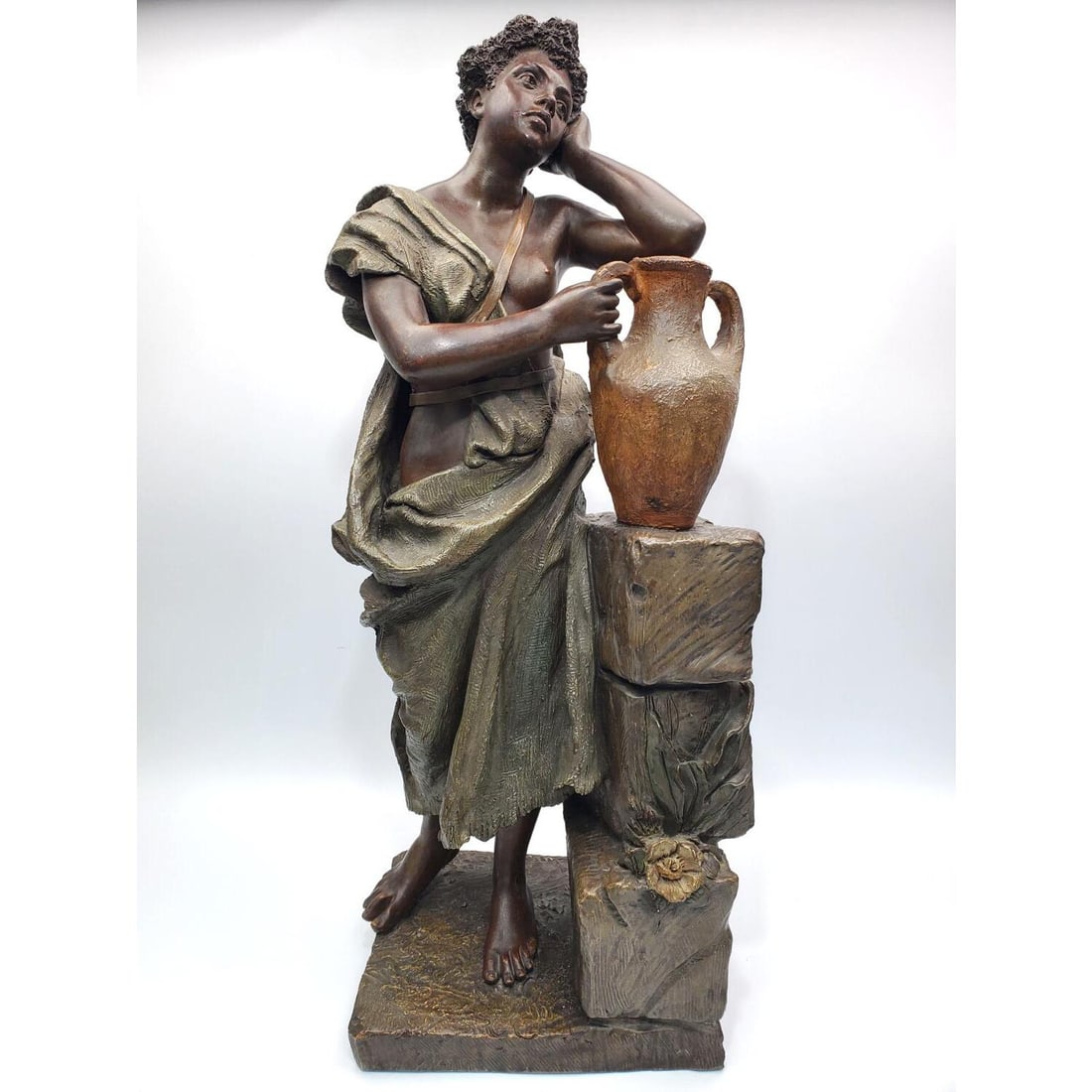 Antique Goldscheider Terracotta Figure by Rozel: Antique Goldscheider Terracotta Figure of an Asian Woman w/ a Jug. Signed Rozel on the Base. Condition: Generally Very Good. Dimensions: H-23.5" x L-10" x D-6.75". Provenance: From a Long Island, NY H