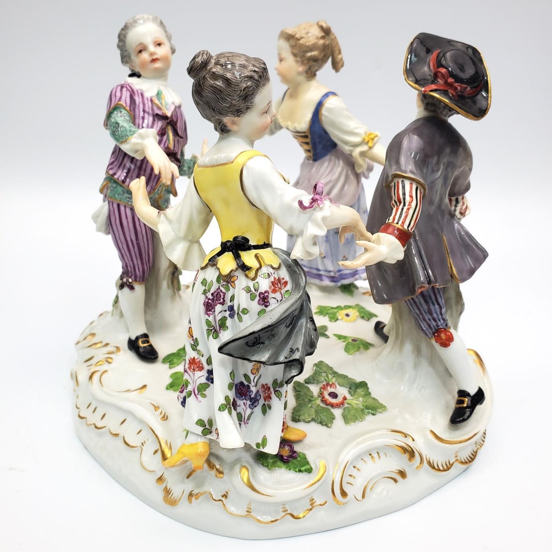 Antique 19th c. Meissen Porcelain Figure: Antique 19th Century Meissen Porcelain Figure of 4 People Playing Ring Around the Rosie. Fully Marked. Condition: Generally Good w/ Some Repairs on the Edges and Chips. Dimensions: H-6.25" x W-6.5". P