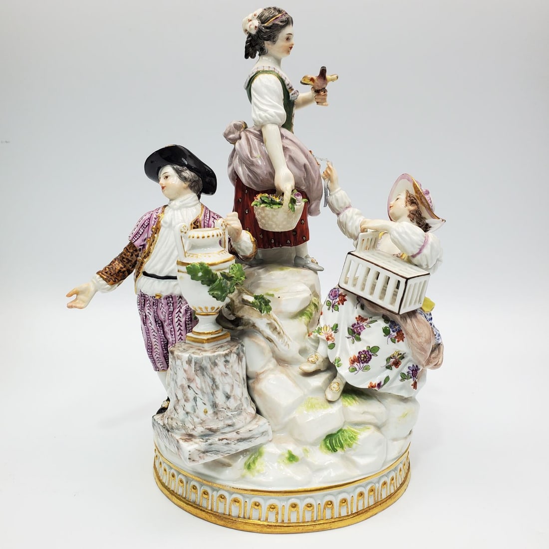 Antique 19th Century Meissen Porcelain Figure: Antique 19th Century Meissen Porcelain Figure of a Man & Two Women in an Outside Setting. Fully Marked. Condition: Generally Good w/ Some Losses, Chips, & Repairs.Dimensions: H-8.25" x W-7". Provenanc