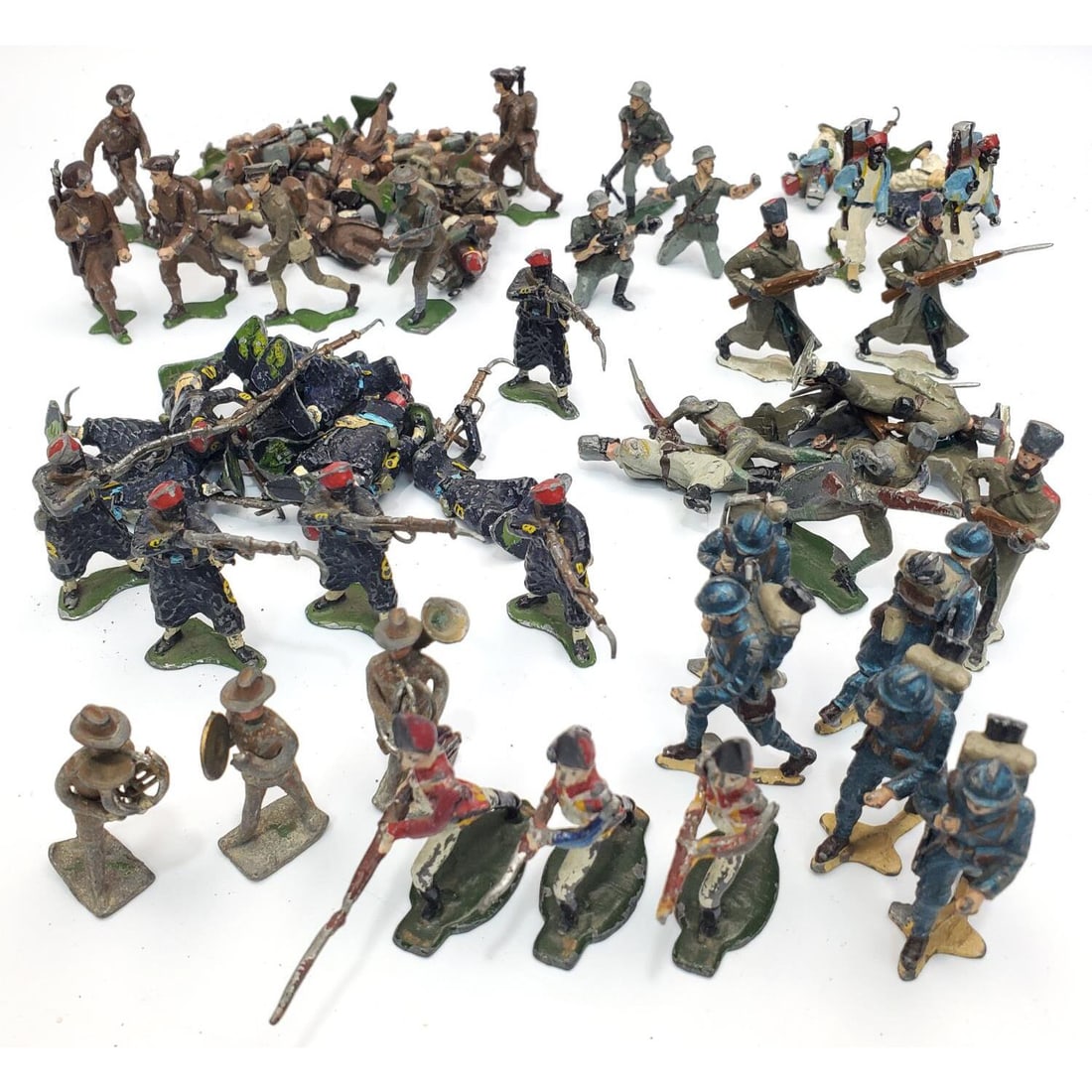 Group Lot of 60 Antique Miniature Lead Soldiers: Group Lot of 60 Antique Miniature Lead Soldiers w/ Various Figures.Condition: As Found w/ Paint Losses & a Couple w/ Missing Parts. Dimensions: H- 1.75". Provenance: From a Long Island, NY Home. Pleas