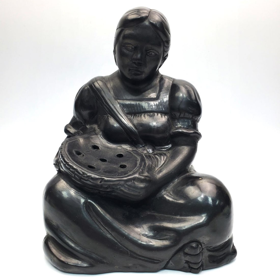 Vintage Mexican Black Pottery Incense Burner: Vintage Mexican Black Pottery Figural Incense Burner Depicting a Woman w/ a Basket. Condition: Generally Good. Dimensions: H-9.25" x L-7" x D-8". Provenance: From a New York City Apartment. Please not