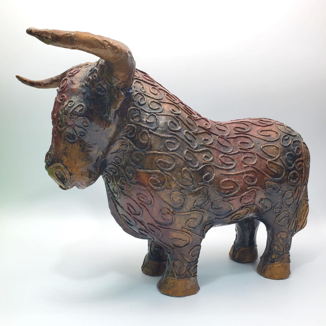Jeanne Valentine, French/Mexican (b.1940) Figure: Jeanne Valentine, French/Mexican (b.1940) Papier Mache Figure of a Bull. Comes w/ Original Sticker at The Bottom. Condition: Generally Very Good. Some Wear to The Edges of The Feet. Dimensions: L-16.5