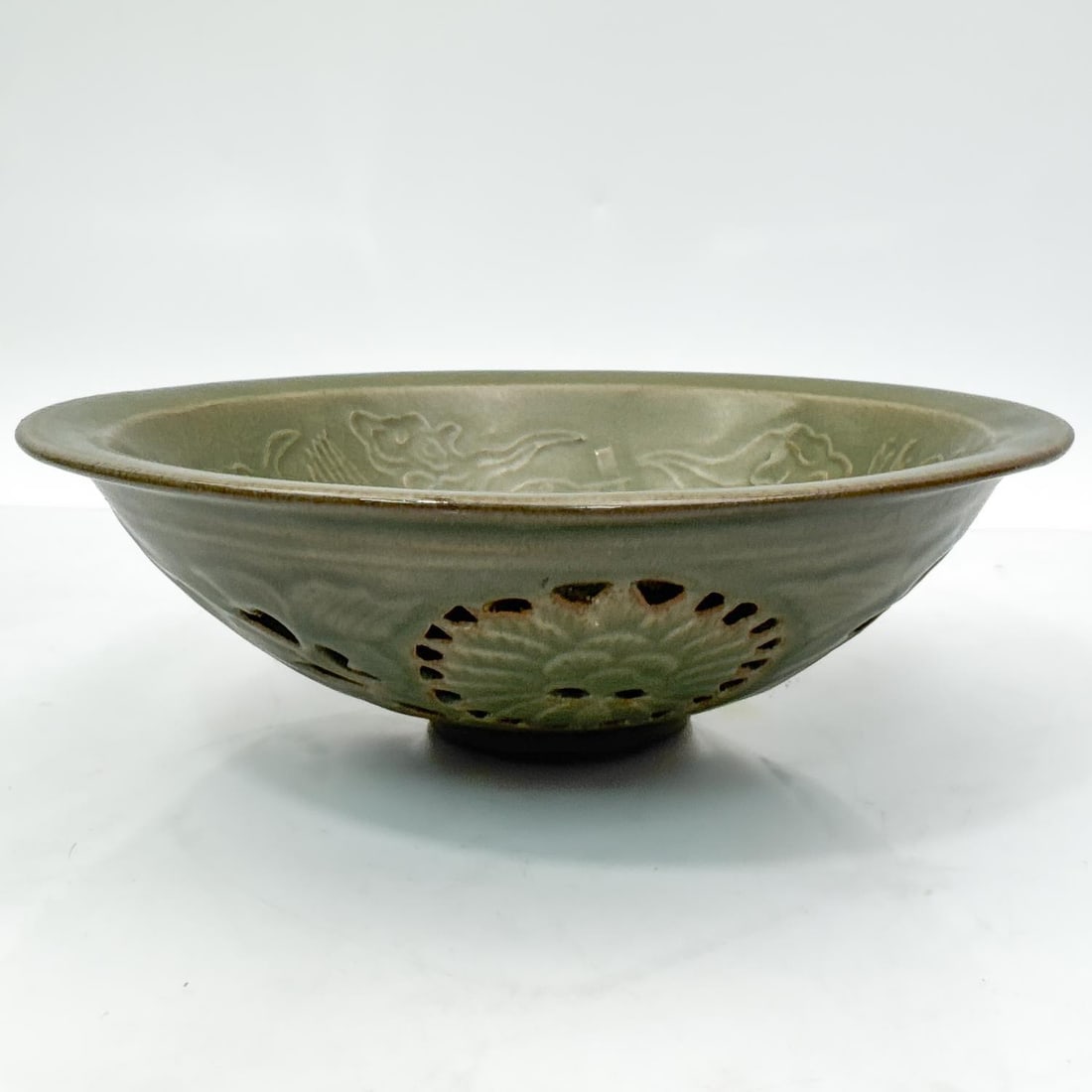 Fine Chinese Celadon Porcelain Bowl: Fine Chinese Celadon Porcelain Bowl. The Inside is Decorated w/ 2 Flying Cranes. The Outer Part Has Pierced Flowers. In Original, Fitted Box. Condition: Excellent. Dimensions: Bowl-Dia-7.2" x H-2.2".