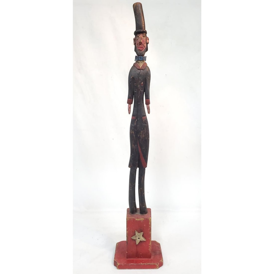 Antique Carved Wood Painted Statue: Antique Carved Wood Painted Statue Probably Depicting Abraham Lincoln. Signed On The Bottom. Condition: Heavy Scratches & Paint Loss.Dimensions: H-35". Provenance: From a Long Island Home. Please note
