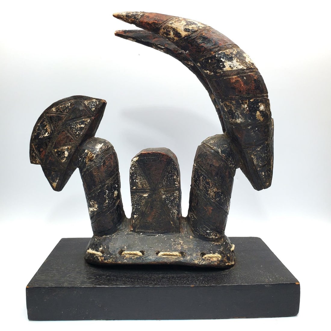 Antique African Carved Wood Mossi Dance Headdress: Antique African Carved Wood Mossi Ceremonial Dance Headdress on Wood Base. Condition: Generally Good w/ Some Losses Due to Age & Use. Dimensions: Carving Alone-L-11.5" x H-11.5". Base-11.5" x 5.75". P