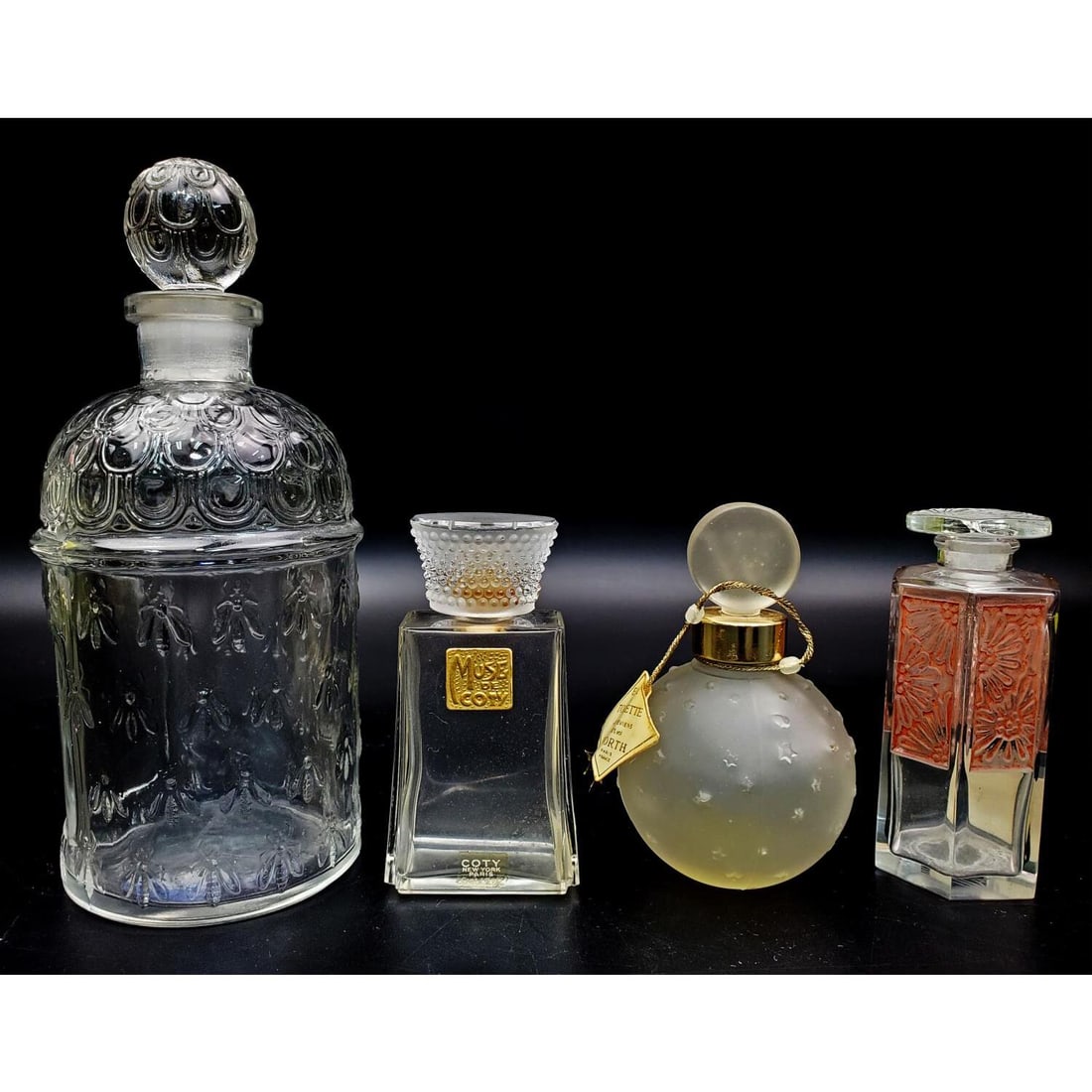 Lot of 4 Antique & Vintage Glass Perfume Bottles: Lot of 4 Antique & Vintage Glass Perfume Bottles Including Andre Jollivet 1920's Art Deco Frosted Glass Bottle w/ Red Stain Floral Decor, "Guerlain" Bee 1960's Embossed Glass Bottle, Muse de Coty Perf