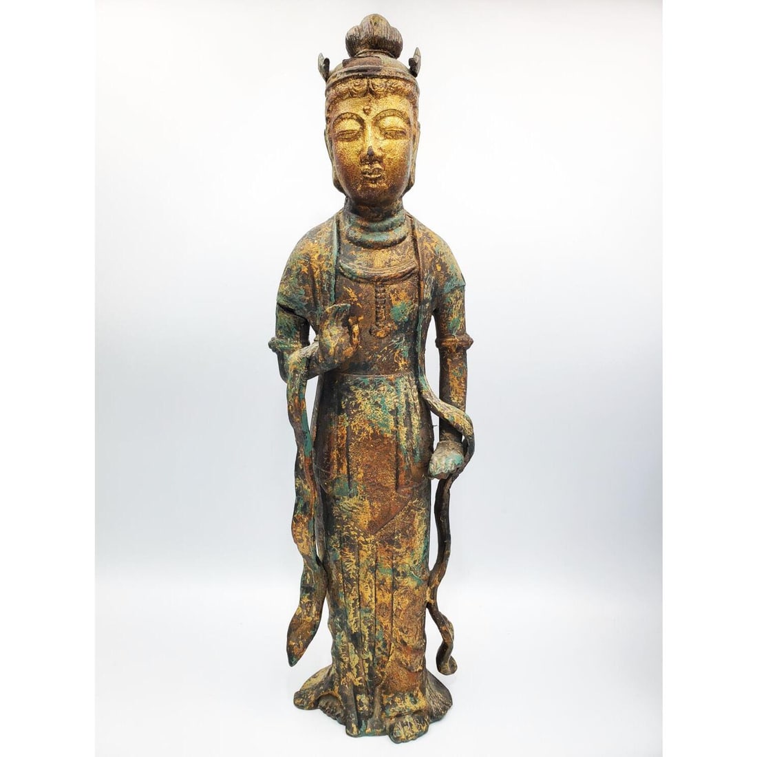 Distressed Cast iron Figure of Quanyin: Distressed Cast iron Figure of the Bodhisattva Quanyin, Depicted Standing with a Crown. Condition: Generally Very Good. Dimensions: H- 20" x W- 6". Provenance: From a Long Island, NY Home. Please note