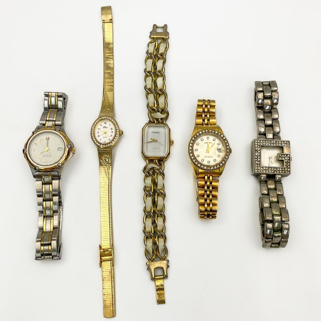 Lot of 5 Vintage Watches: Lot of 5 Vintage Watches Including Wenger, Gruen, Faberge, Gucci & Chanel. Condition: Generally Good, Sold As Is. Please Note- We Do Not Guarantee the Workability or Mechanism of Any WatchesDimensions