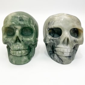 2 Carved Stone Skulls