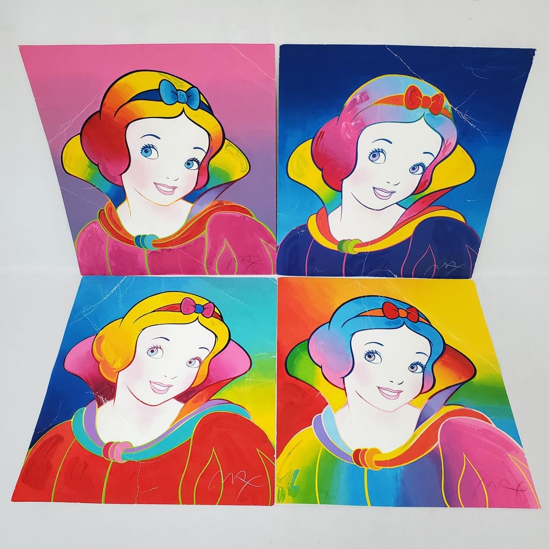 Peter Max (b.1937), American 4 Original Serigraphs: Peter Max (b.1937), American Lot of 4 Original Serigraph Prints of Disney Princesses. All 4 Have Blind Stamps, are Signed Lower Right, & Numbered Lower Left. Unframed. Condition: Poor w/ Heavy Creases