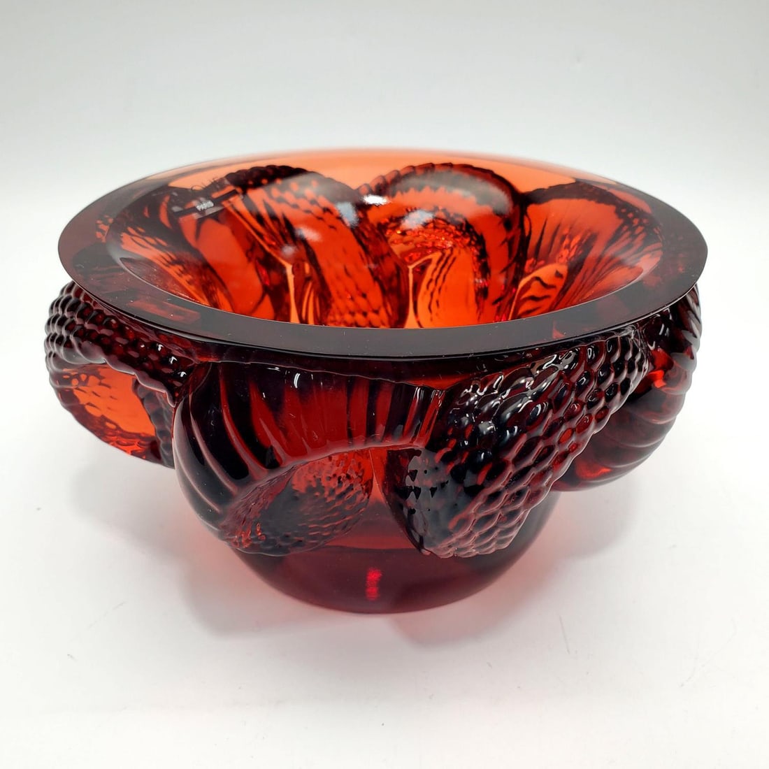 Lalique France Crimson Glass "Serphant" Bowl: Lalique France Crimson Glass "Serphant" Bowl. Fully Signed & Retains The Original Lalique Sticker Label. Condition: Excellent. Dimensions: Dia-6.75" x H-3.8". Provenance: From a New York City Apartmen