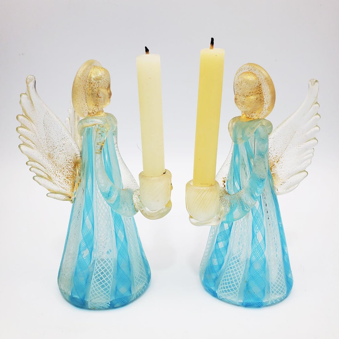 Pair of Vintage Venetian Glass Candle Holders: Pair of Vintage Venetian Italian Blue Ribbon & White Latticino Glass Candle Holder Angels w/ Gold Flecks. Condition: Excellent. Dimensions: H-6" x Dia-2.5". Provenance: From a New York City Apartment.