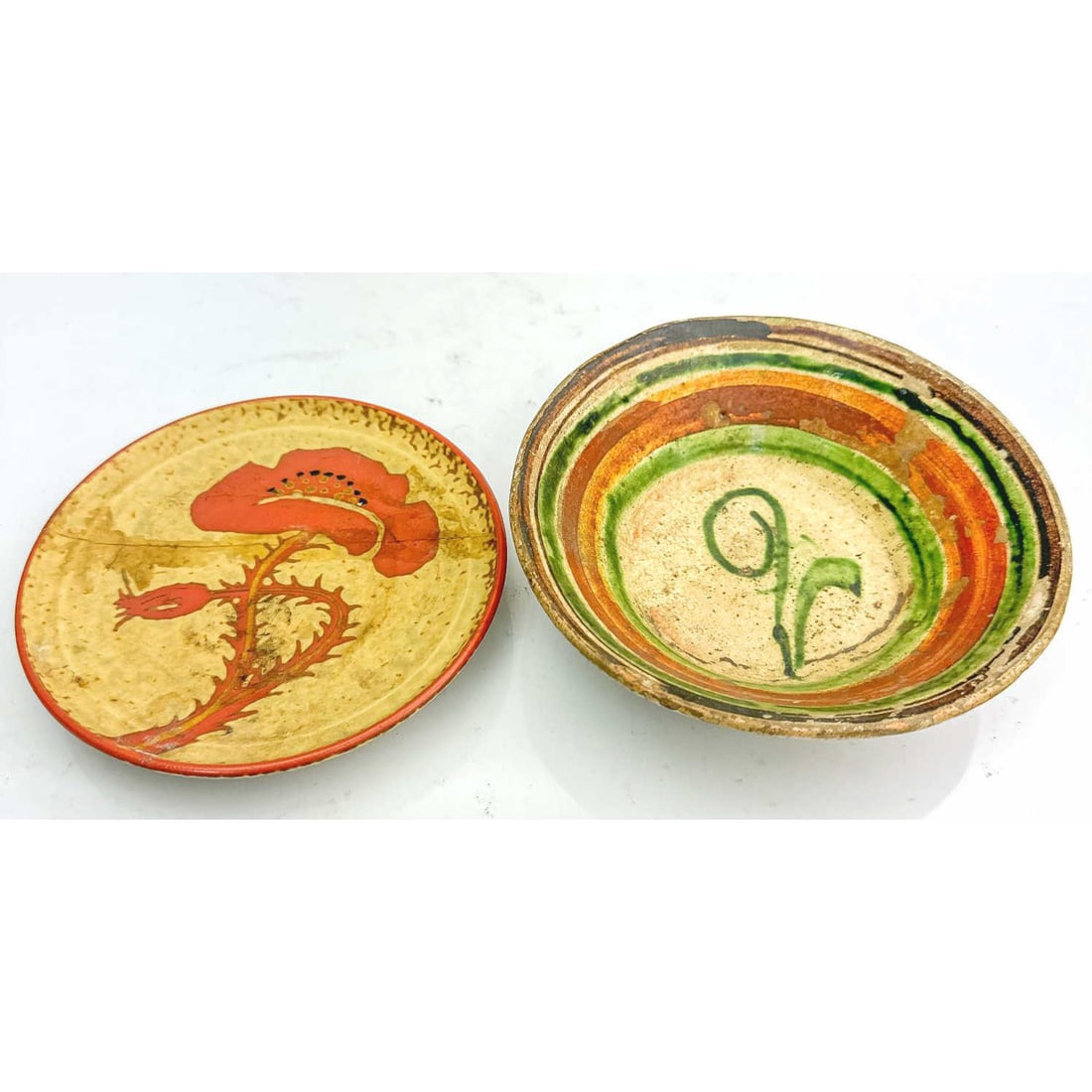 Lot of 2 Old Pottery Dishes Incl. 1 w/ Red Flower: Lot of 2 Old Pottery Dishes Including 1 w/ a Red Flower. Condition: Both Have Chips & Losses. The Red Flower One Has Repairs. Sold As Is. Dimensions: Larger Dia- 6". Provenance: From a Long Island, NY