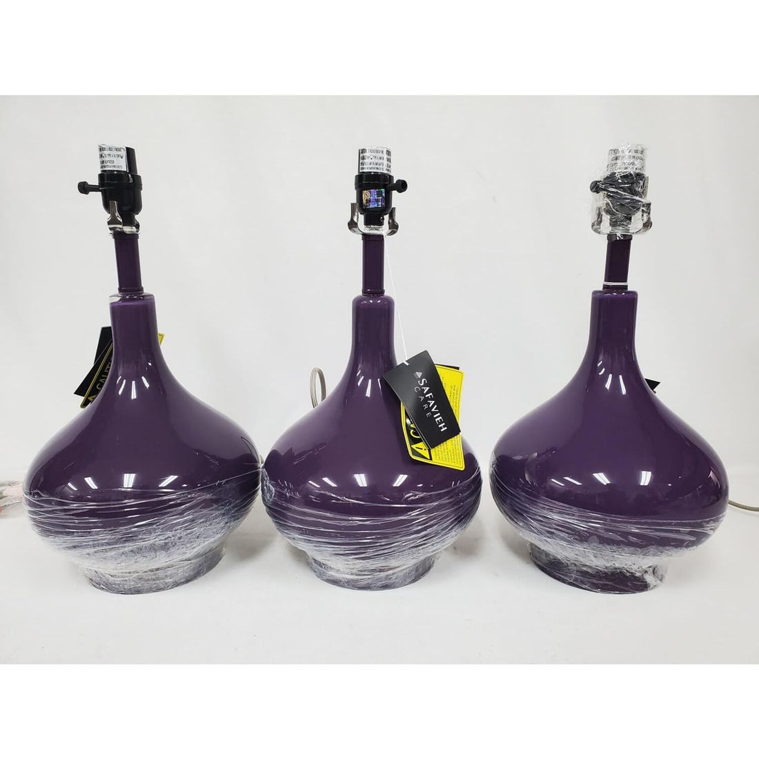 Lot of 3 "Safavieh" Purple Lamps: Lot of 3 "Safavieh" Purple Lamps. Condition: Generally Very Good. Never Used. Please Note- We Do Not Guarantee the Workability or Mechanism of Any Lamps or Chandeliers. Dimensions: Each H-17.5" x Dia-