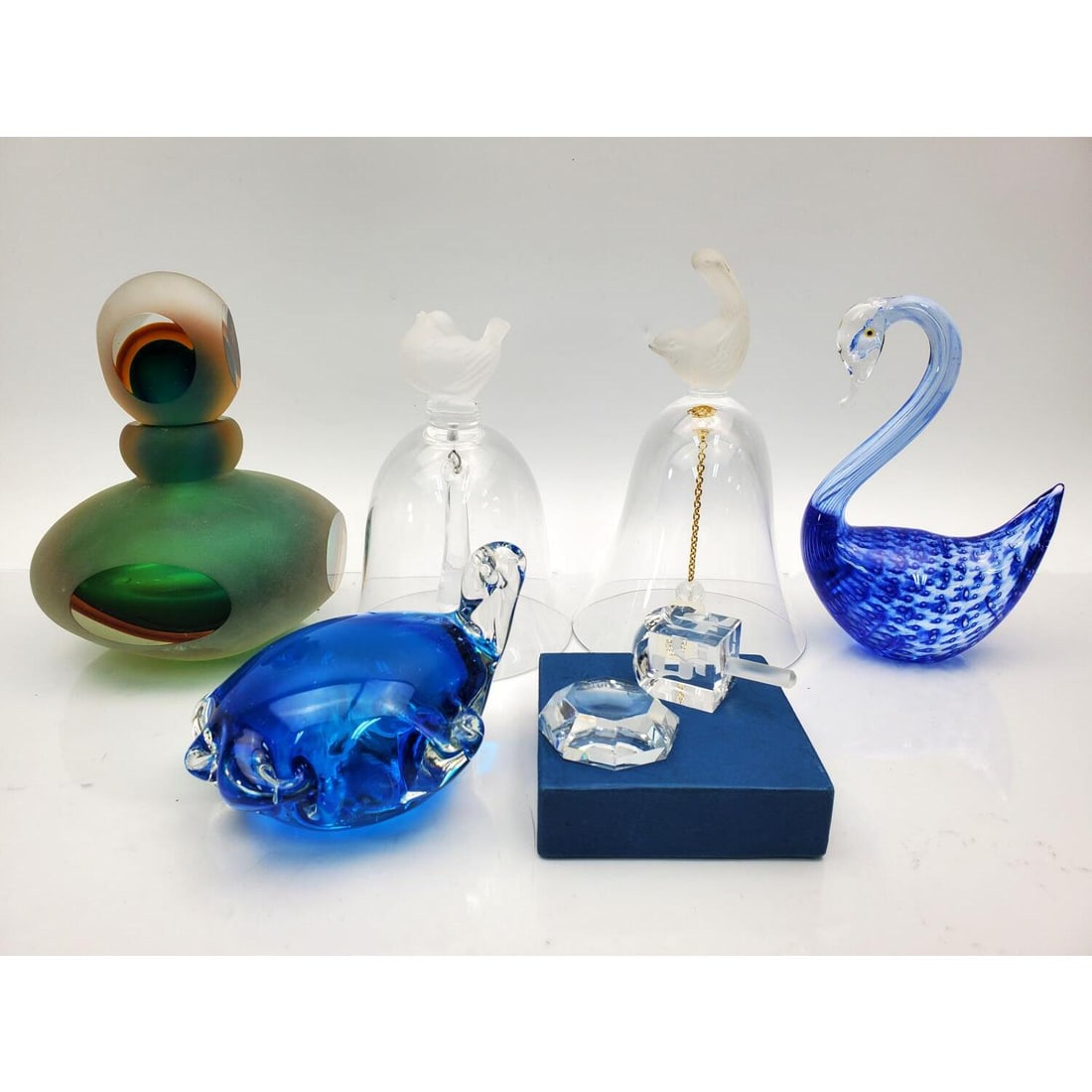Lot of 5 Vintage Art Glass Items: Lot of 6 Vintage Art Glass Items Including a Perfume Bottle, 2 Bells, 2 Figures, & a Judaica Glass Dreidel. Condition: Generally Good. Dimensions: Largest H-5.75" x Dia-4.5". Provenance: From a Long I